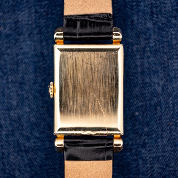 Omega N-6243 smooth outer caseback in 14k gold filled showing honest hairlines from wear