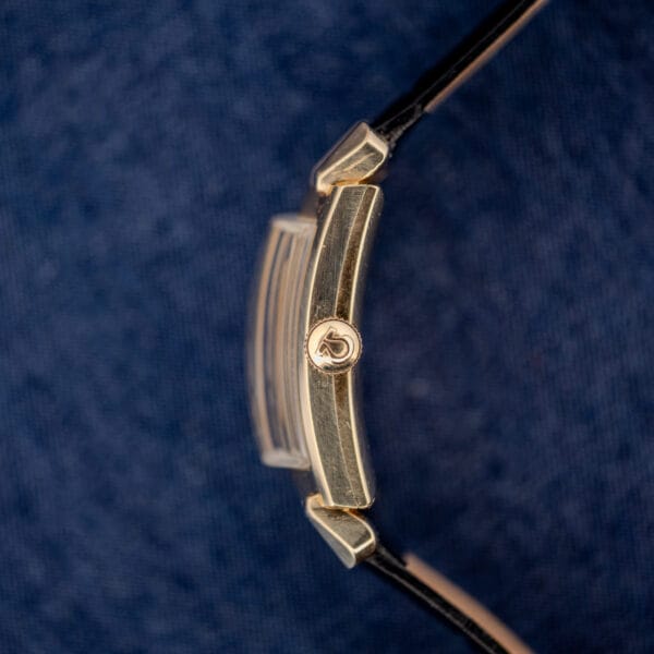 Omega Tank N-6243 crown profile with signed Omega fluted crown and curved case flank