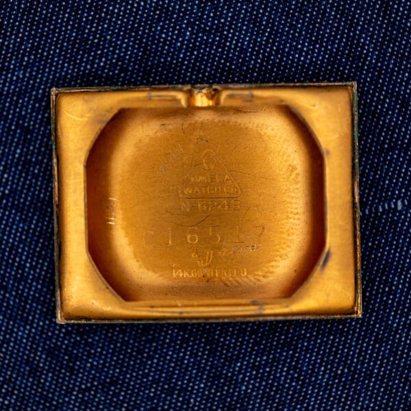 Omega N-6243 inner caseback stamped with Omega Watch Co triangle, N-6243 and 14K GOLD FILLED