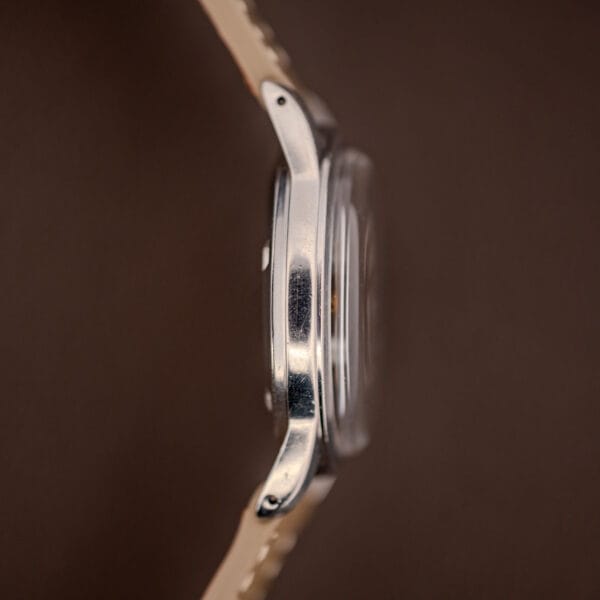 Tissot 6769 stainless steel case side profile with faceted lugs and domed acrylic crystal