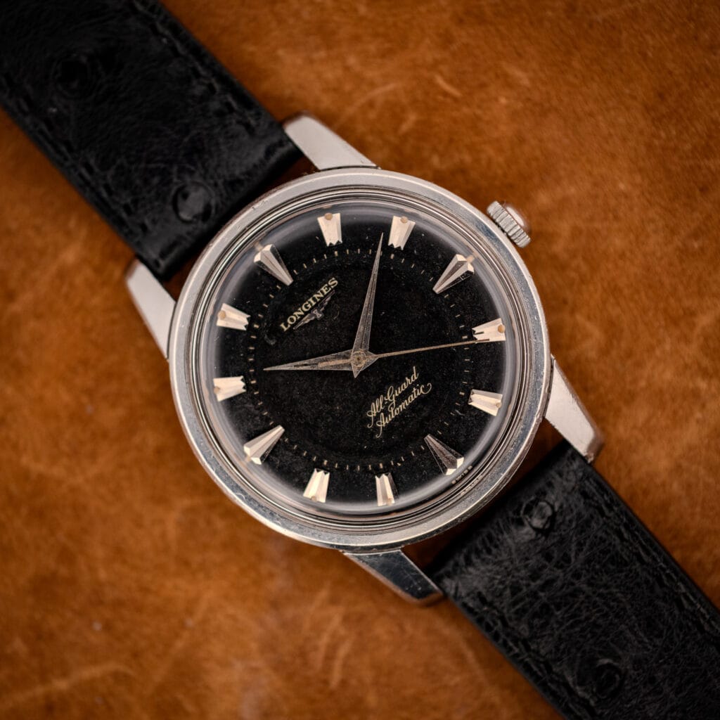 Longines All Guard ref. 9006-1 black gilt dial on black ostrich strap, front view