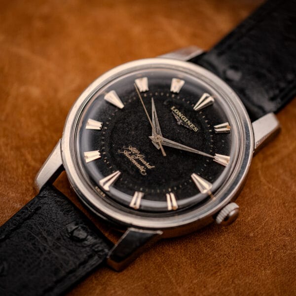 Vintage Longines All Guard 9006-1 stainless case at three-quarter angle on tan leather