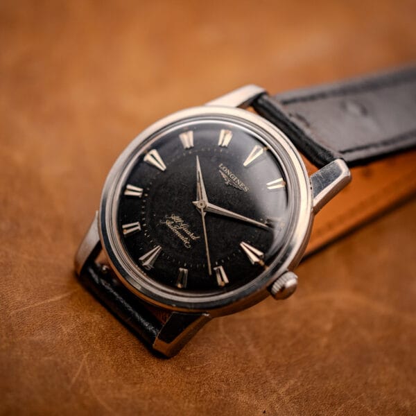 Longines All Guard 9006-1 dramatic three-quarter macro showing gilt dial and polished case