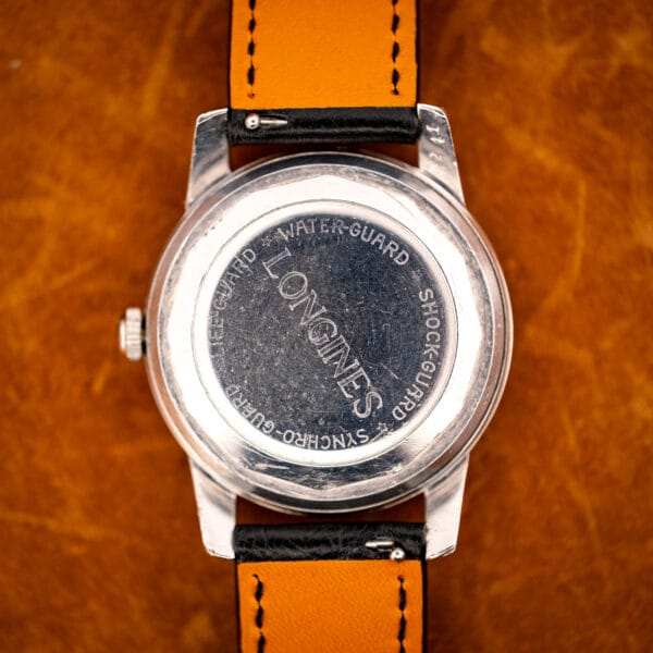 Longines All Guard caseback stamped LIFE-GUARD WATER-GUARD SHOCK-GUARD SYNCHRO-GUARD around LONGINES