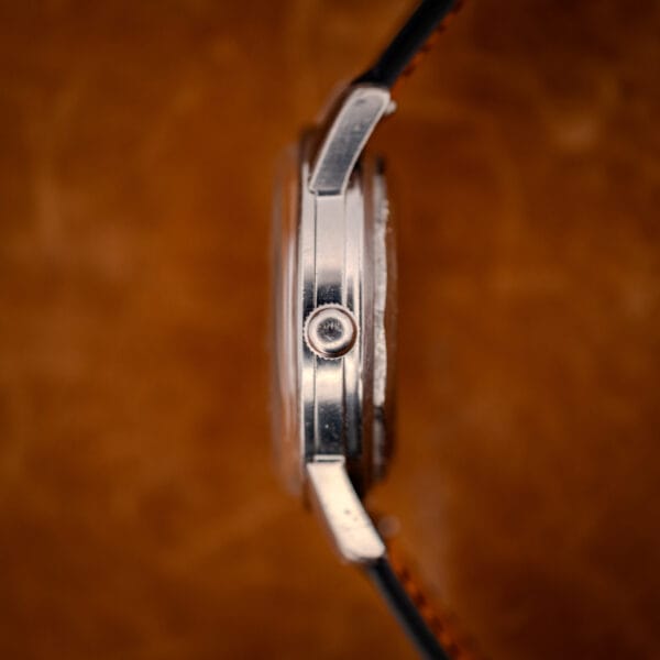 Longines All Guard 9006-1 stainless case side profile with winding crown, macro