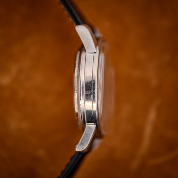 Longines All Guard polished stainless case band and lugs showing honest wear, side profile