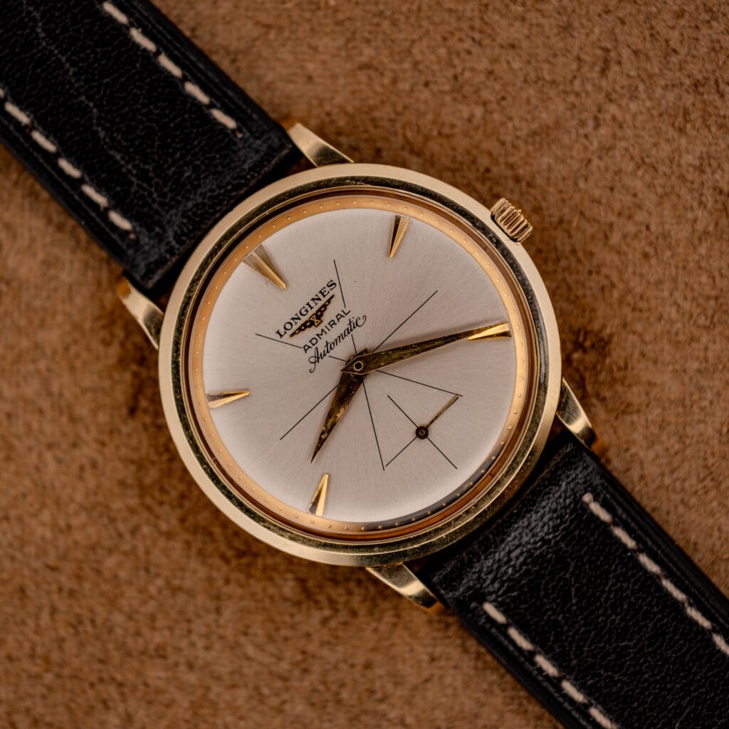 Vintage Longines Admiral automatic ref. 69-240 silver sunburst dial in 10k gold filled case on black leather strap