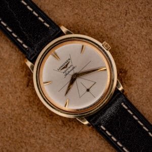 Vintage Longines Admiral automatic ref. 69-240 silver sunburst dial in 10k gold filled case on black leather strap