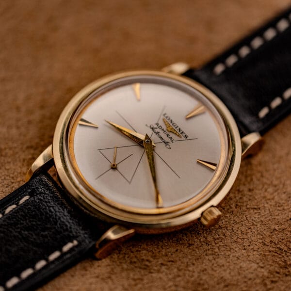 Vintage Longines Admiral 69-240 gold filled case angled view with fluted winding crown and twisted lugs