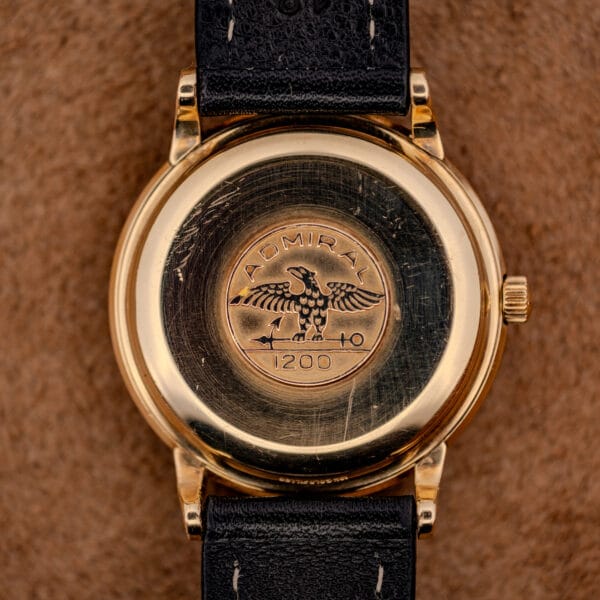 Longines Admiral caseback stamped with the Admiral eagle medallion above the figure 1200 on the gold filled screw back