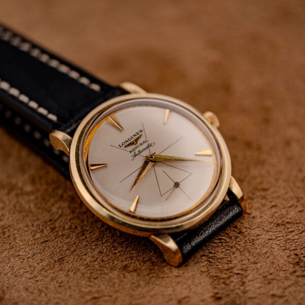 Longines Admiral 69-240 silver sunburst dial with applied gold dart markers and the winged Longines emblem