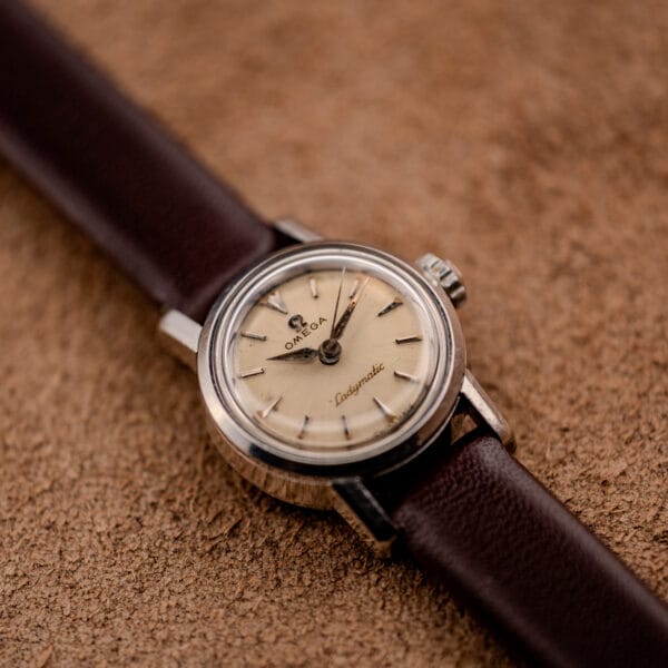 Vintage Omega Ladymatic stainless case profile showing case depth and the signed Omega crown