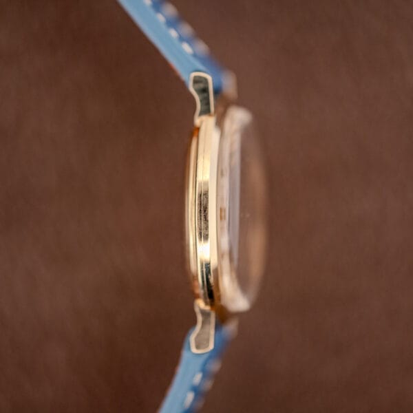 Longines 1116 case band profile in 10k yellow gold filled showing the polished bezel and lugs