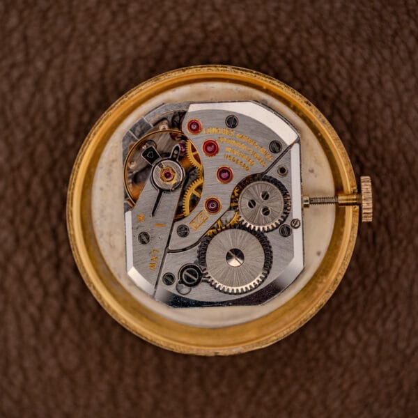 Longines caliber 370 manual wind movement with jeweled bridge inside the gold filled case