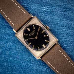 Longines Tank 3007-528 black gilt oval dial in textured 10k gold-filled square case on grey leather strap