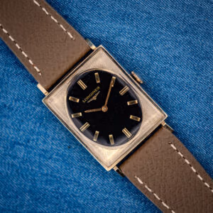 Longines Tank 3007-528 black gilt oval dial in textured 10k gold-filled square case on grey leather strap