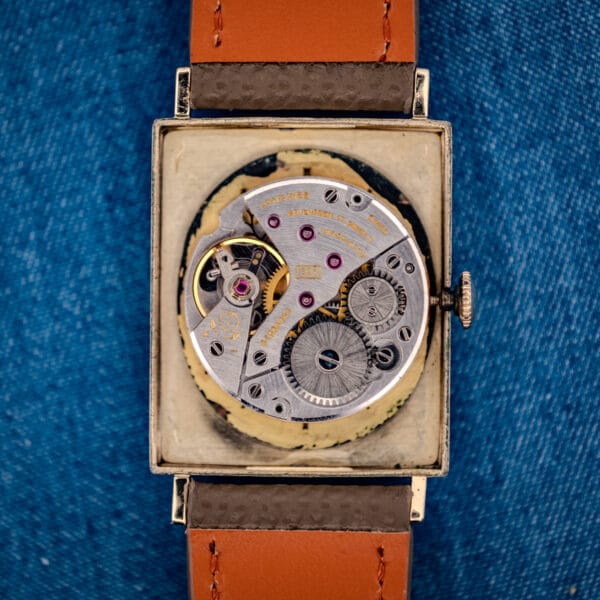 Longines caliber 528 manual-wind movement inside 3007-528 tank case, bridges and balance visible