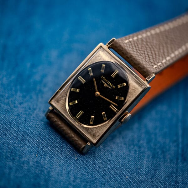 Vintage Longines Tank 3007-528 glamour angle, gilt black oval dial and gold-filled case on grey strap
