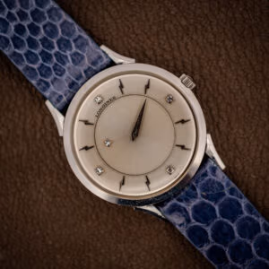 Longines mystery dial 69-230-2A top view, floating dauphine hands over silver sunburst with four diamond markers