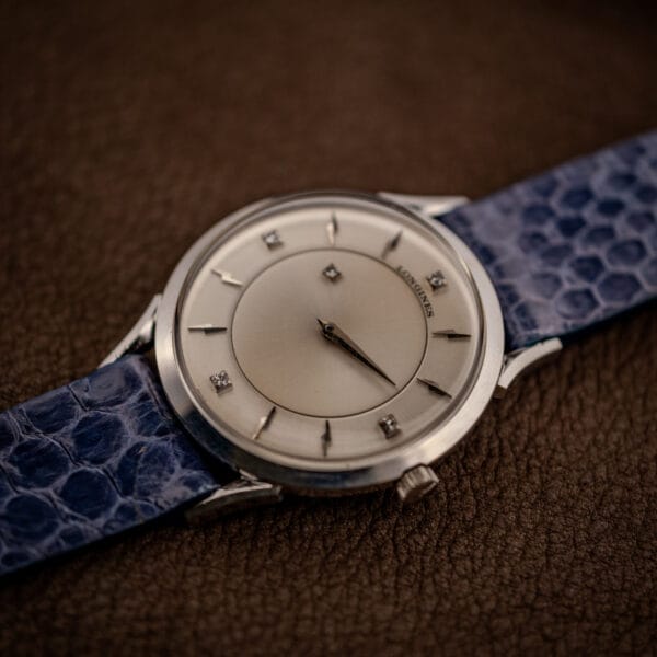 Longines 69-230-2A top-down on leather, floating hands and four diamonds on a two-tier dial
