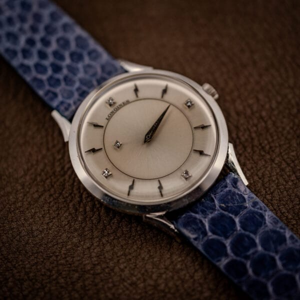 Longines mystery dial angled view showing diamond quarter markers and dart indexes