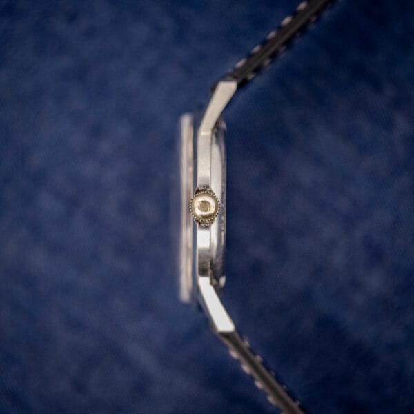 Bulova stainless steel case side profile showing signed crown stamped with the Bulova logo