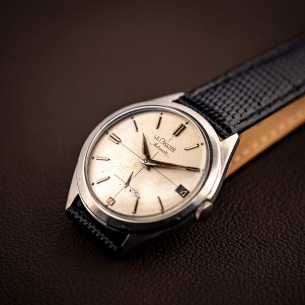LeCoultre E329 cream cross-hair dial flat view showing sub-seconds at six and roulette date at three