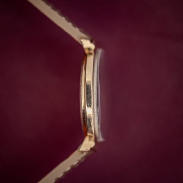 Hamilton Thin-O-Matic slim case side view with tall domed crystal and gold-filled hooded lugs