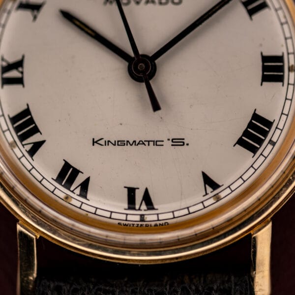 Movado Kingmatic S lower dial reading KINGMATIC S over SWITZERLAND with black Roman numerals