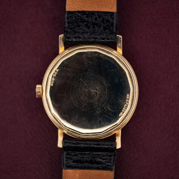 Movado Kingmatic S caseback stamped SUB-SEA and 14K G.FILLED with twelve-sided scalloped edge