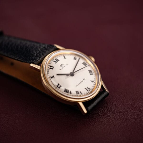 Movado Kingmatic S ref 69664 angled on burgundy leather, white Roman dial and gold filled Sub-Sea case