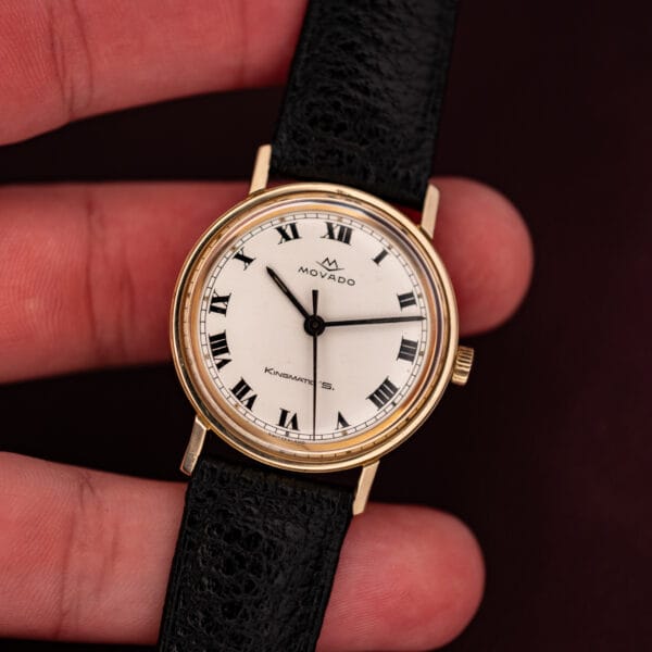 Movado Kingmatic S held in hand for scale, gold filled Sub-Sea case on black leather strap