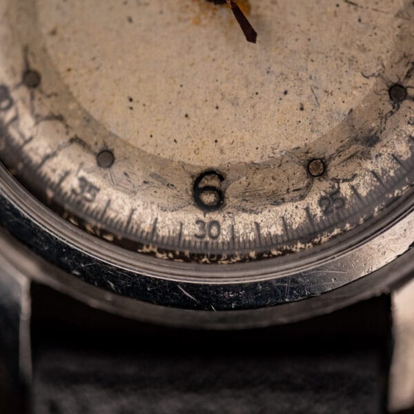 Girard-Perregaux dial detail at six with railroad minute track and aged luminous hour dots