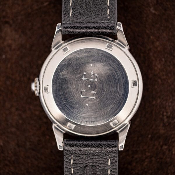 Girard-Perregaux stainless steel caseback exterior with faceted rim and worn brushed finish