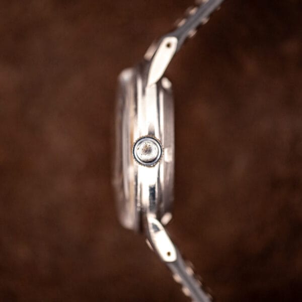 Girard-Perregaux caliber 84 case side profile showing the winding crown and slim steel case band