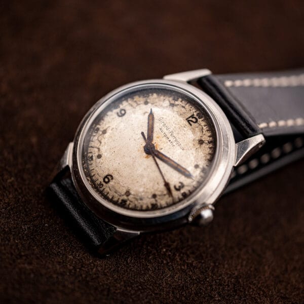 Vintage Girard-Perregaux automatic with central sweep seconds hand and cream military-style dial