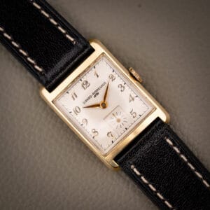 Girard-Perregaux 1791 gold filled tank watch with cream dial and applied gold Arabic numerals on a black leather strap