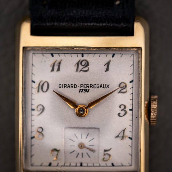 Girard-Perregaux 1791 cream dial close-up showing the GIRARD-PERREGAUX 1791 signature and applied gold Arabic numerals