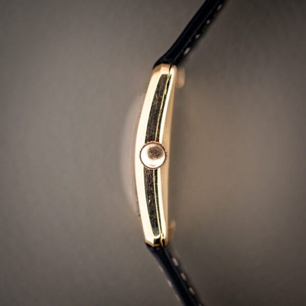 Girard-Perregaux 1791 gold filled tank case side profile showing the fluted crown at three oclock