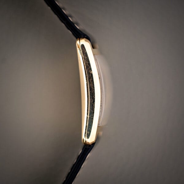 Girard-Perregaux 1791 tank case profile with domed acrylic crystal and polished gold filled band