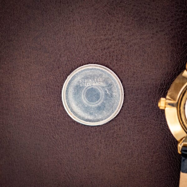 Concord inner caseback disc stamped STAINLESS STEEL BACK on the gold plated dress watch