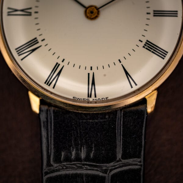 Concord dress watch lower dial reading SWISS MADE above six, black Roman numerals and fine minute track