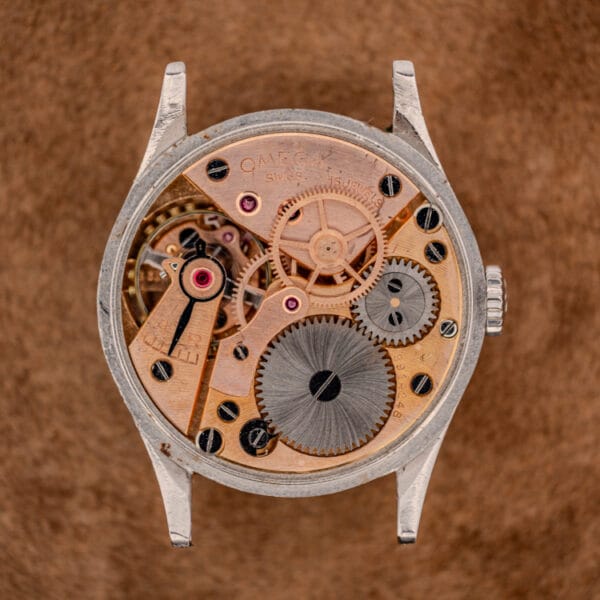 Omega caliber 30T2 SC manual movement, rose gilt bridges signed OMEGA SWISS 16 JEWELS with center seconds