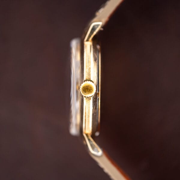 Longines 2264-1 side profile showing the fluted gold crown and slim gold filled case band
