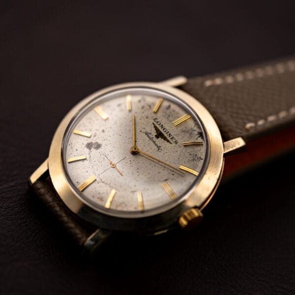 Longines Automatic 2264-1 three-quarter view with speckled dial, fluted gold crown and thin gold filled dress case