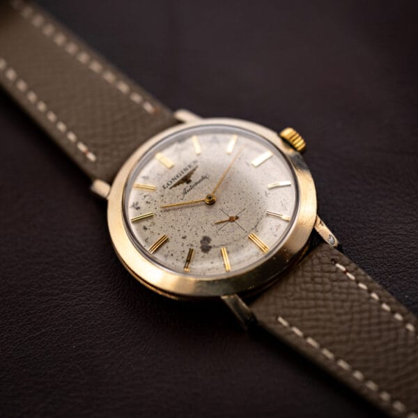 Longines Automatic 2264-1 angled view with small seconds at six and the winged hourglass logo on a silvered dial
