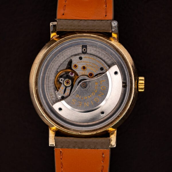 Longines caliber 19A automatic movement with signed LONGINES AUTOMATIC rotor and 17 jewels, inside gold filled case