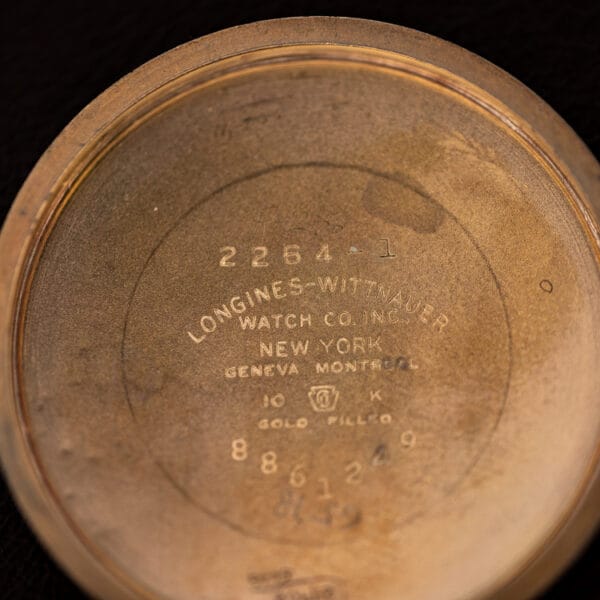 Longines-Wittnauer 2264-1 inner caseback macro, reference and 10K GOLD FILLED marks, New York Geneva Montreal