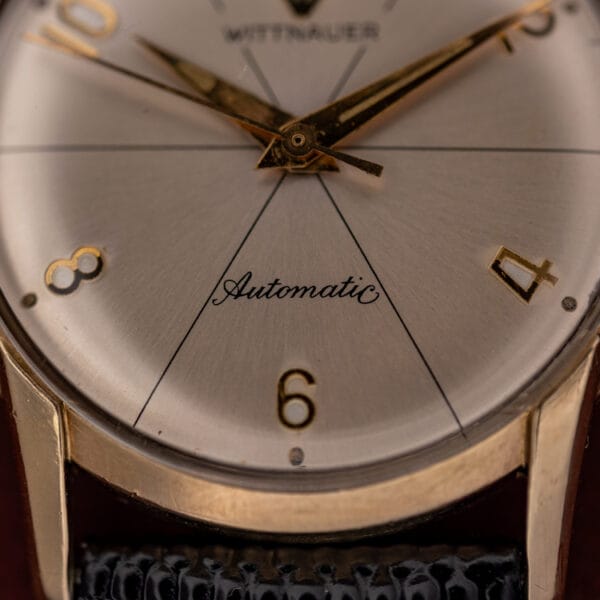 Wittnauer Automatic 2673-11SR lower dial with cursive Automatic script, applied gold numerals, and gold filled case edge
