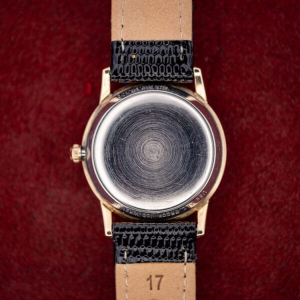 Wittnauer 2673-11SR stainless steel snap caseback with concentric turning and honest hairline wear inside a gold filled rim